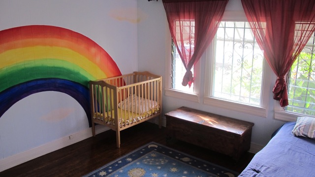 Room with bed and crib, 2nd angle.